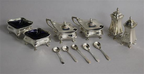 An early 20th century six piece silver condiment set, Birmingham, 1908/11 and six associated silver condiment spoons.